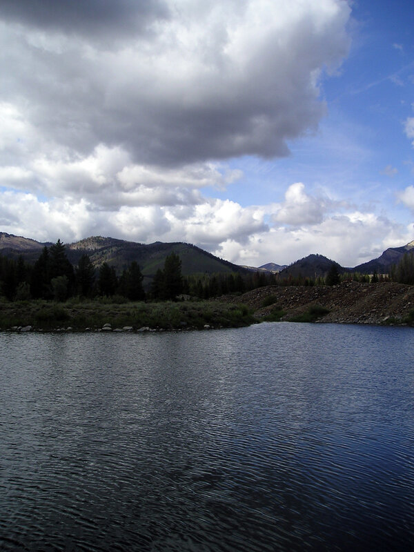 Lake with mountains and clouds
