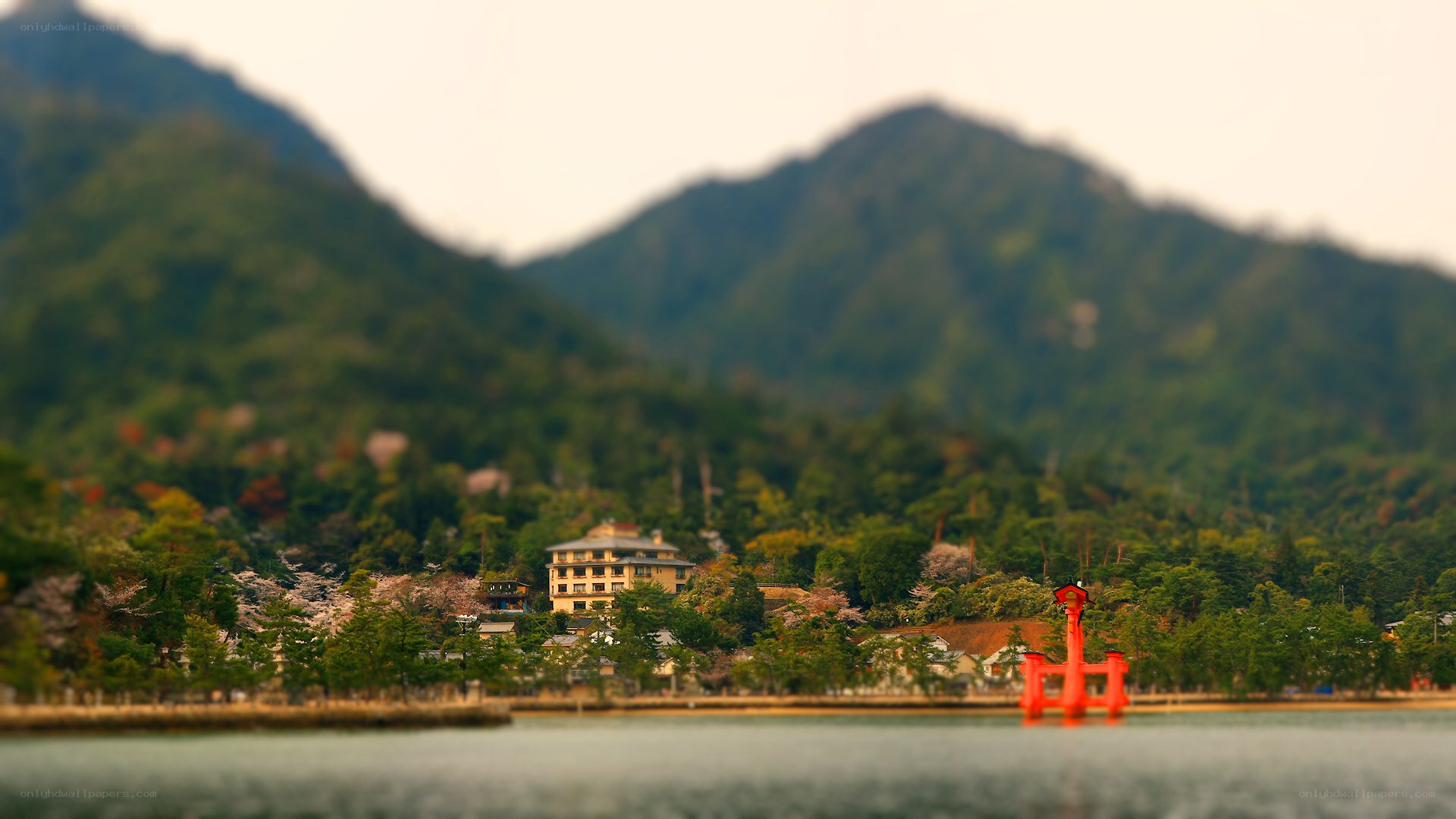 Lake with mountains and red structure