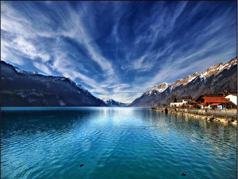 Lake with mountains and village