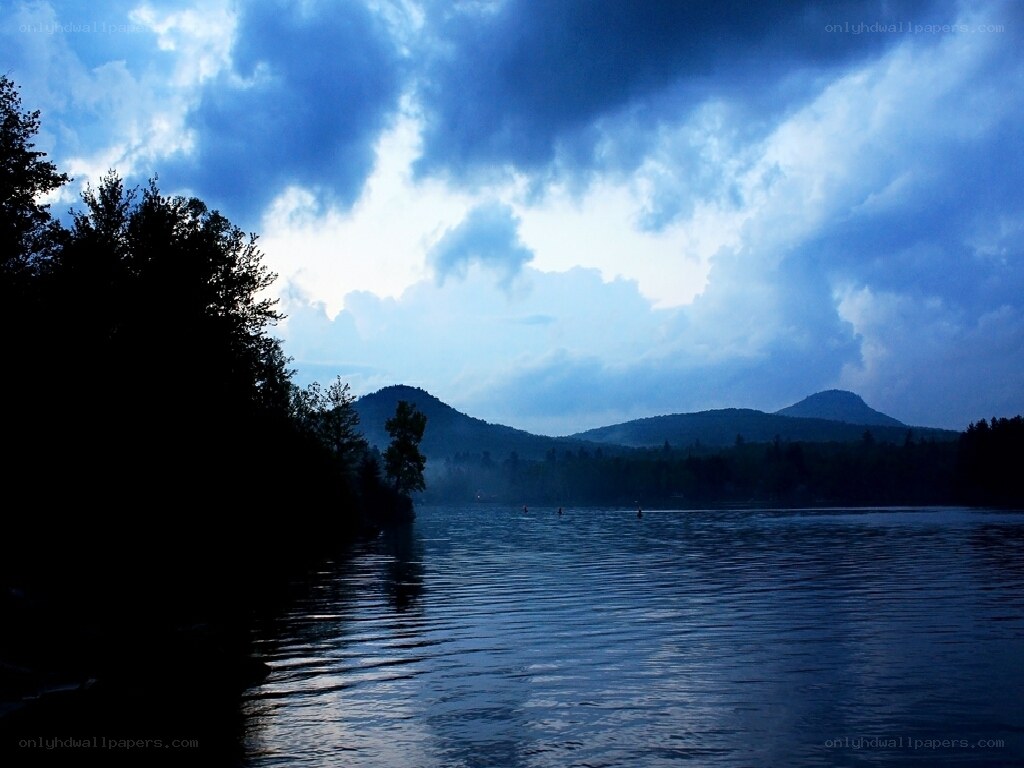 Lake with mountains at dusk