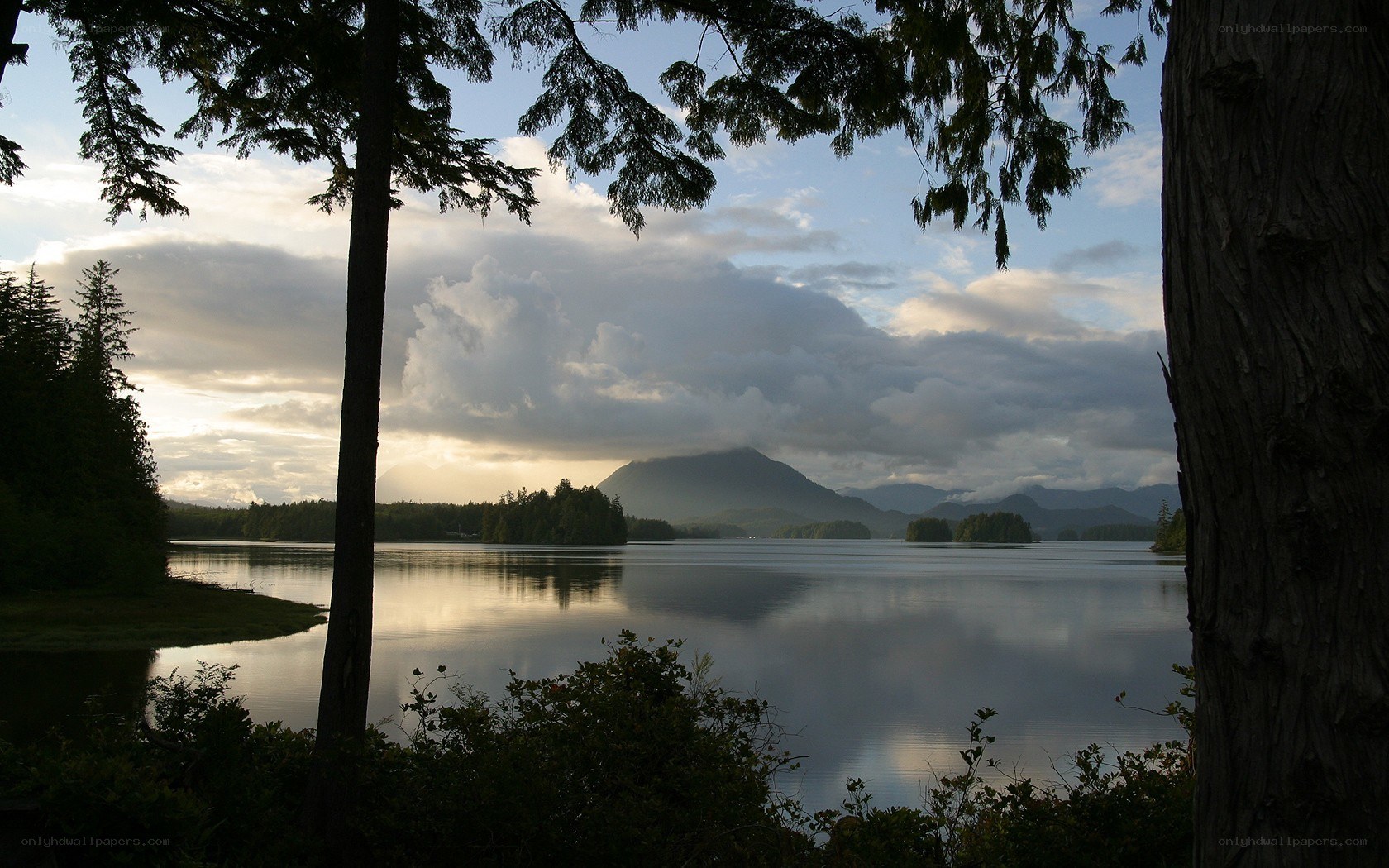 Lake with mountains at sunset