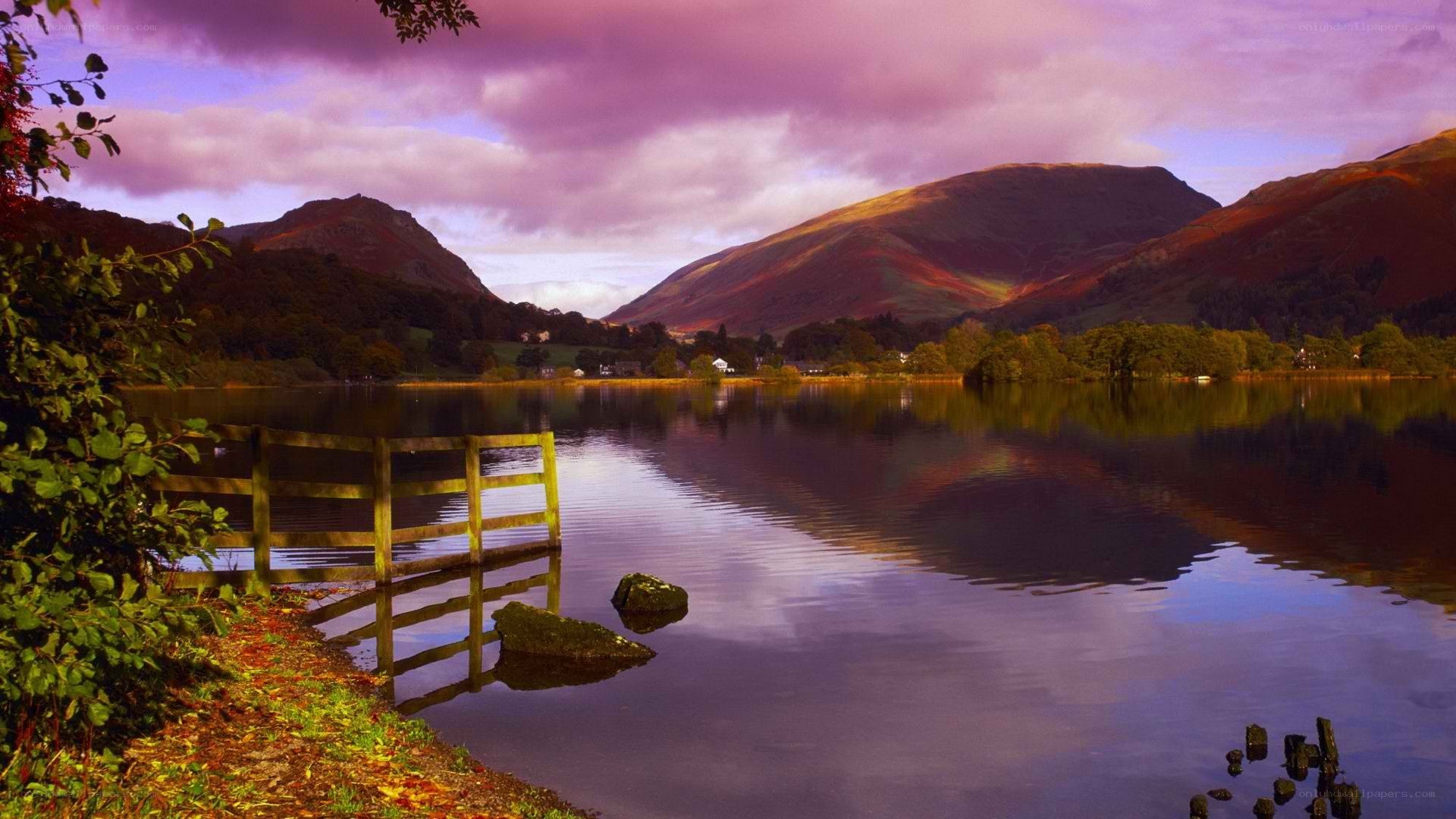 Lake with mountains at sunset