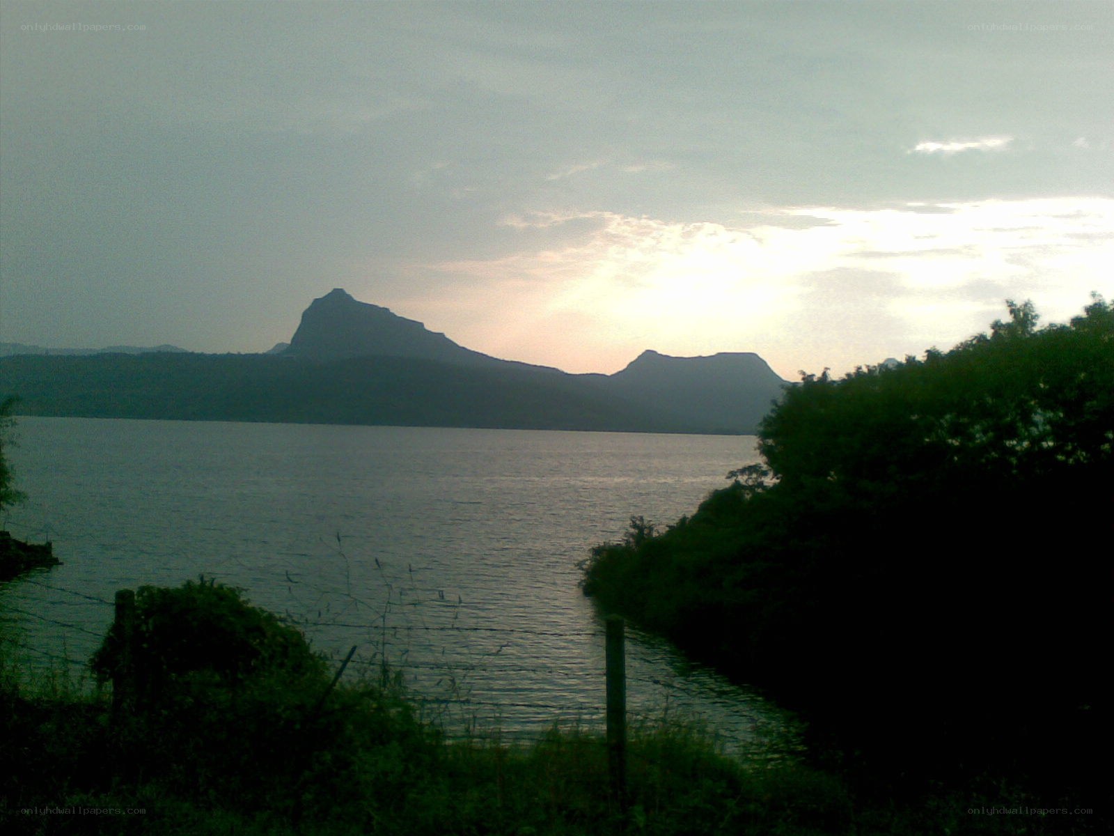 Lake with mountains at sunset