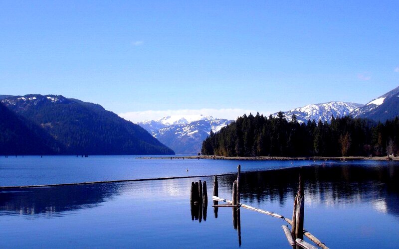 Lake with Mountains — Blue, Serene, Afternoon, Photograph, Forest, Wooden Posts