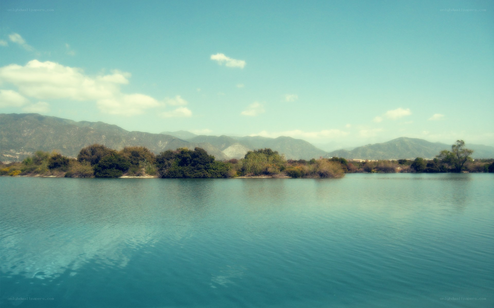 Lake with mountains in background