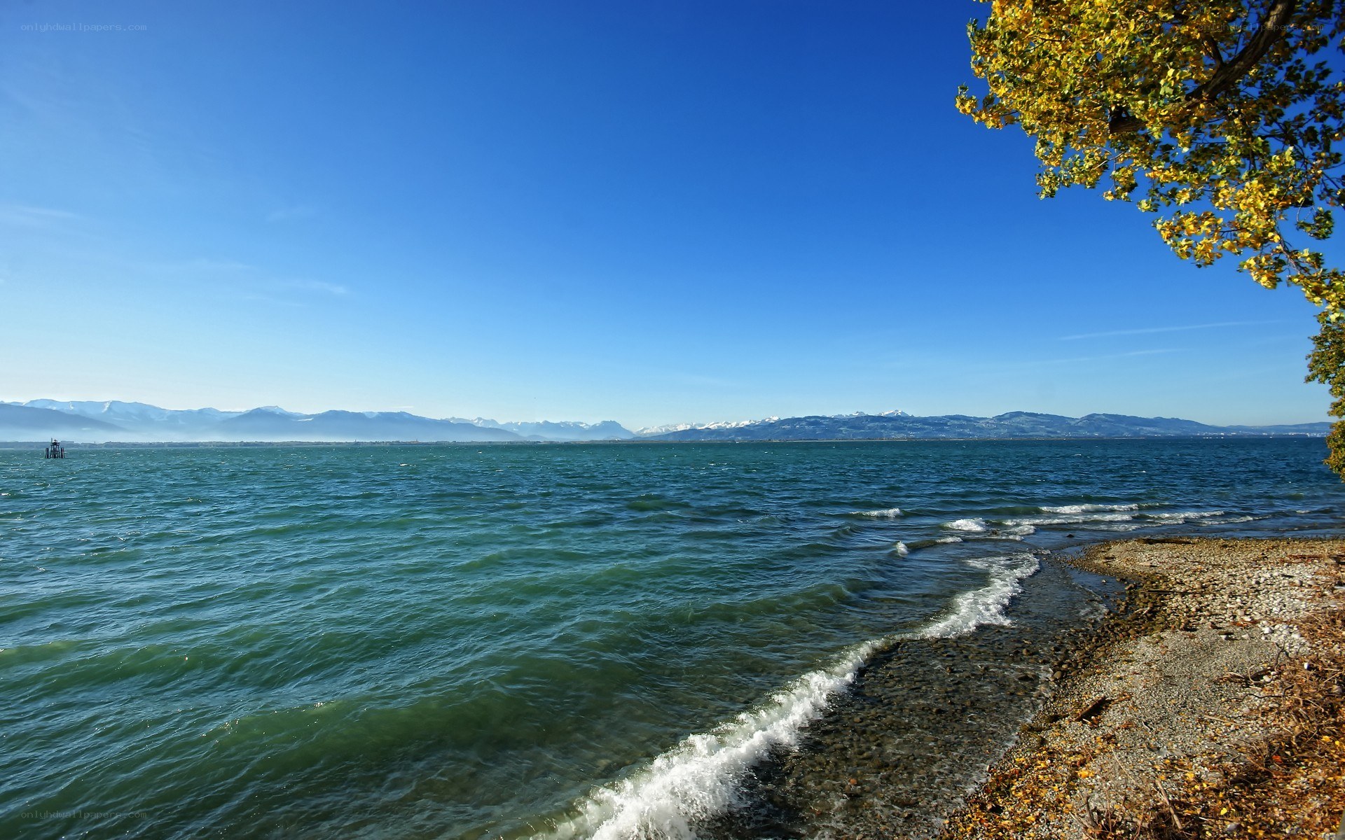 Lake with mountains in background