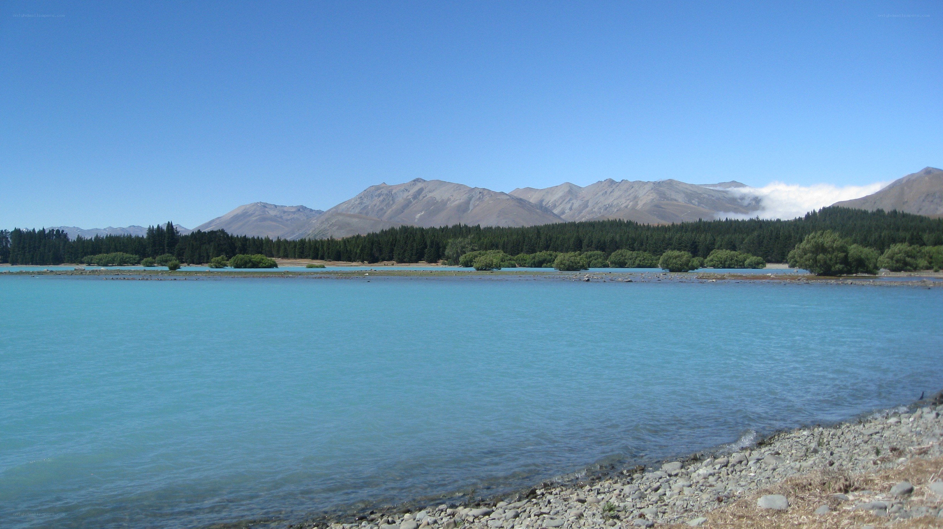 Lake with mountains in background