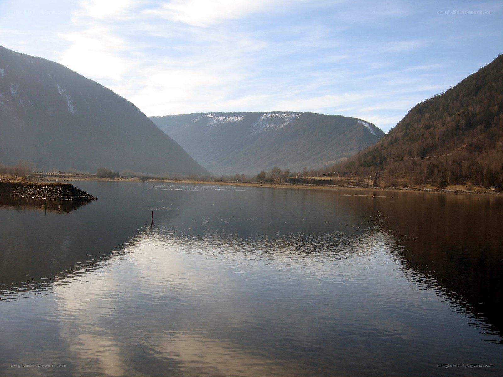 Lake with mountains in background