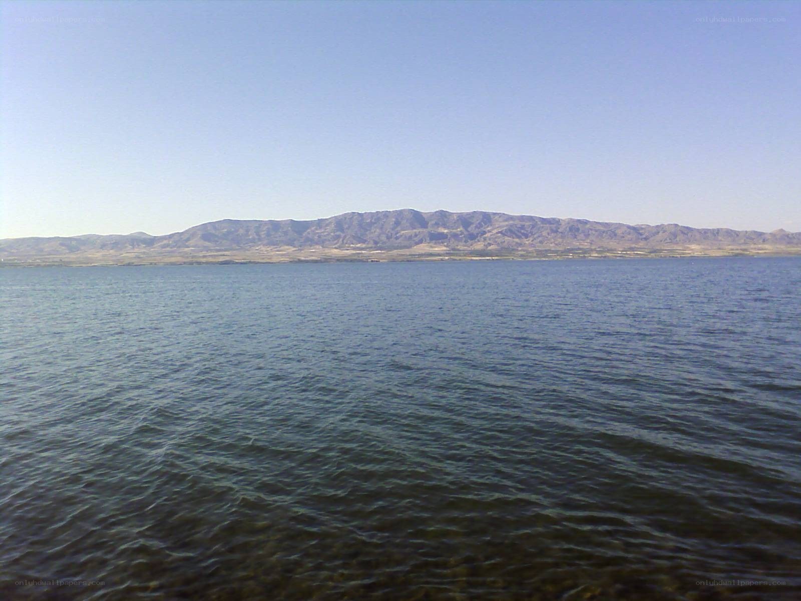 Lake with mountains in background
