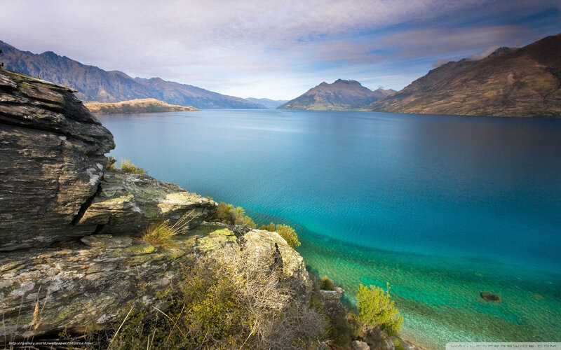 Lake with mountains in background