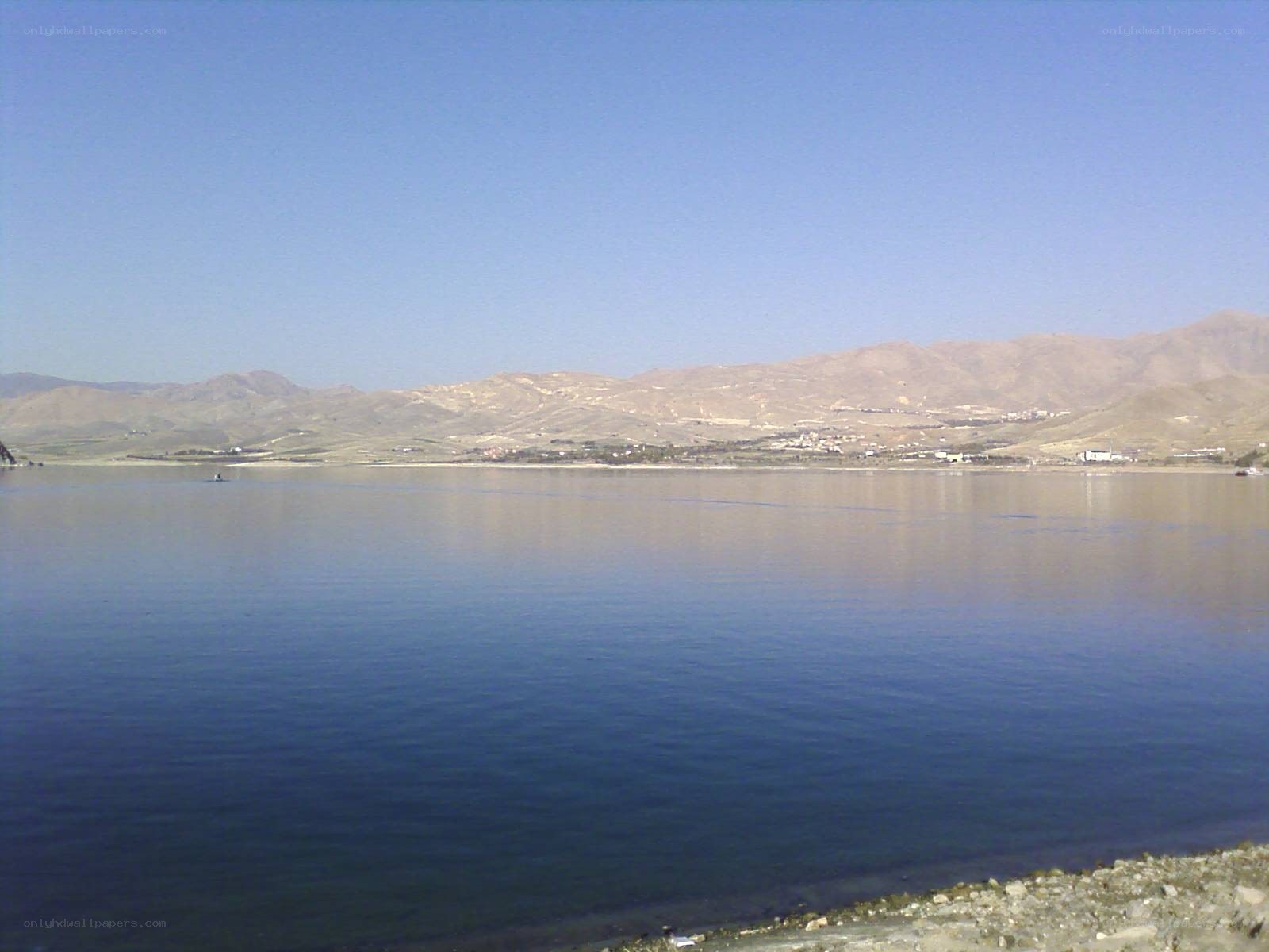 Lake with mountains in background