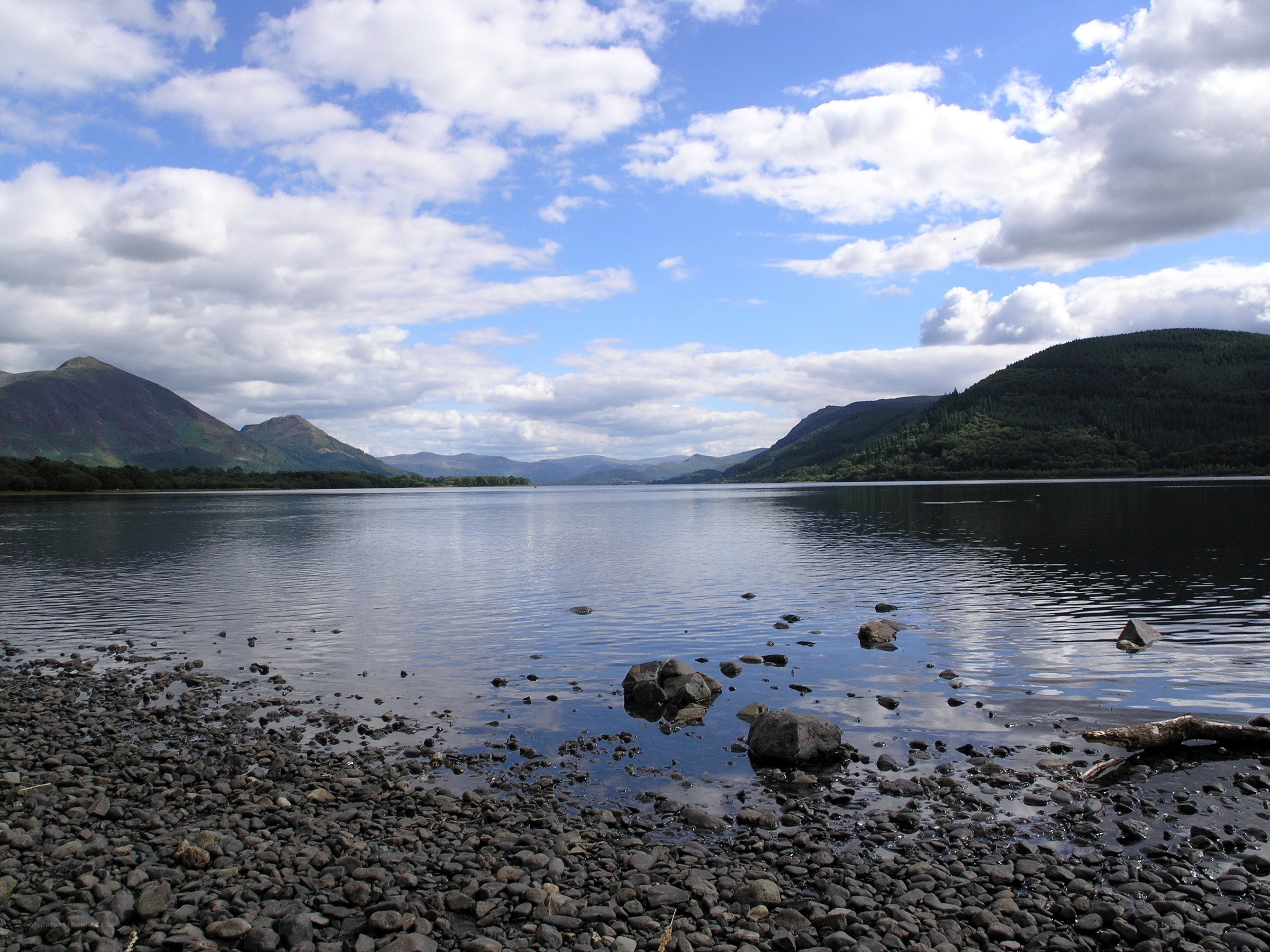 Lake with mountains in background