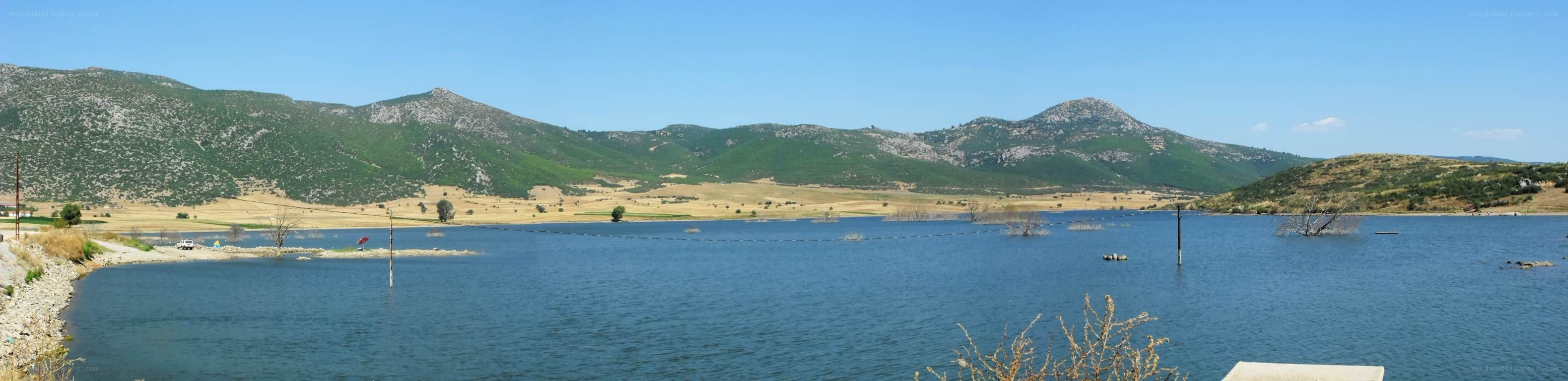 Lake with mountains in background