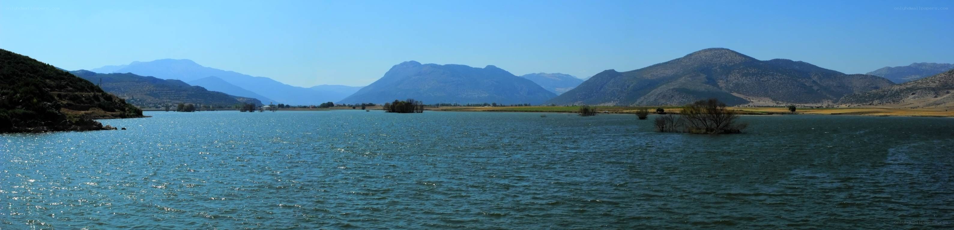 Lake with mountains in background