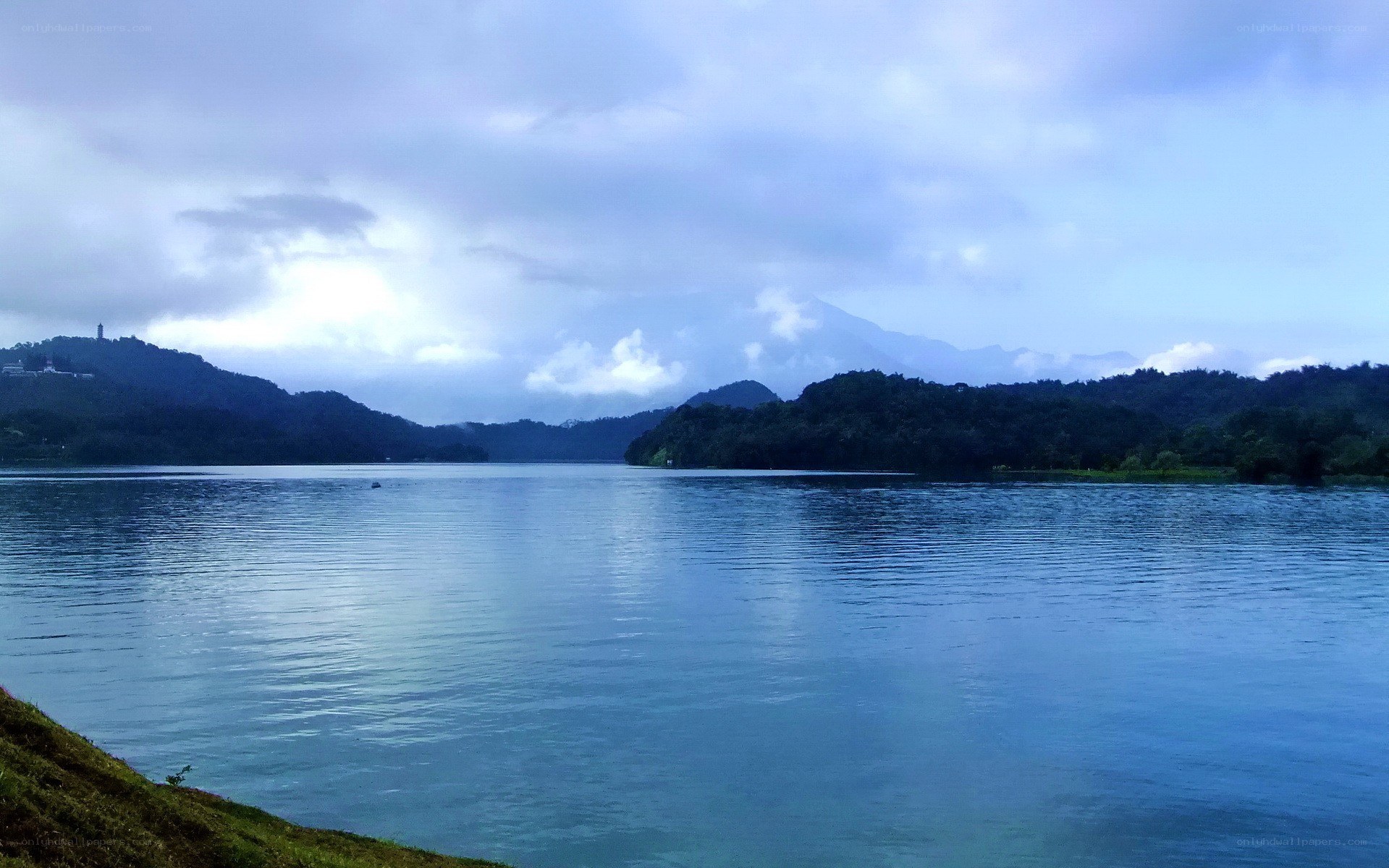 Lake with mountains in background
