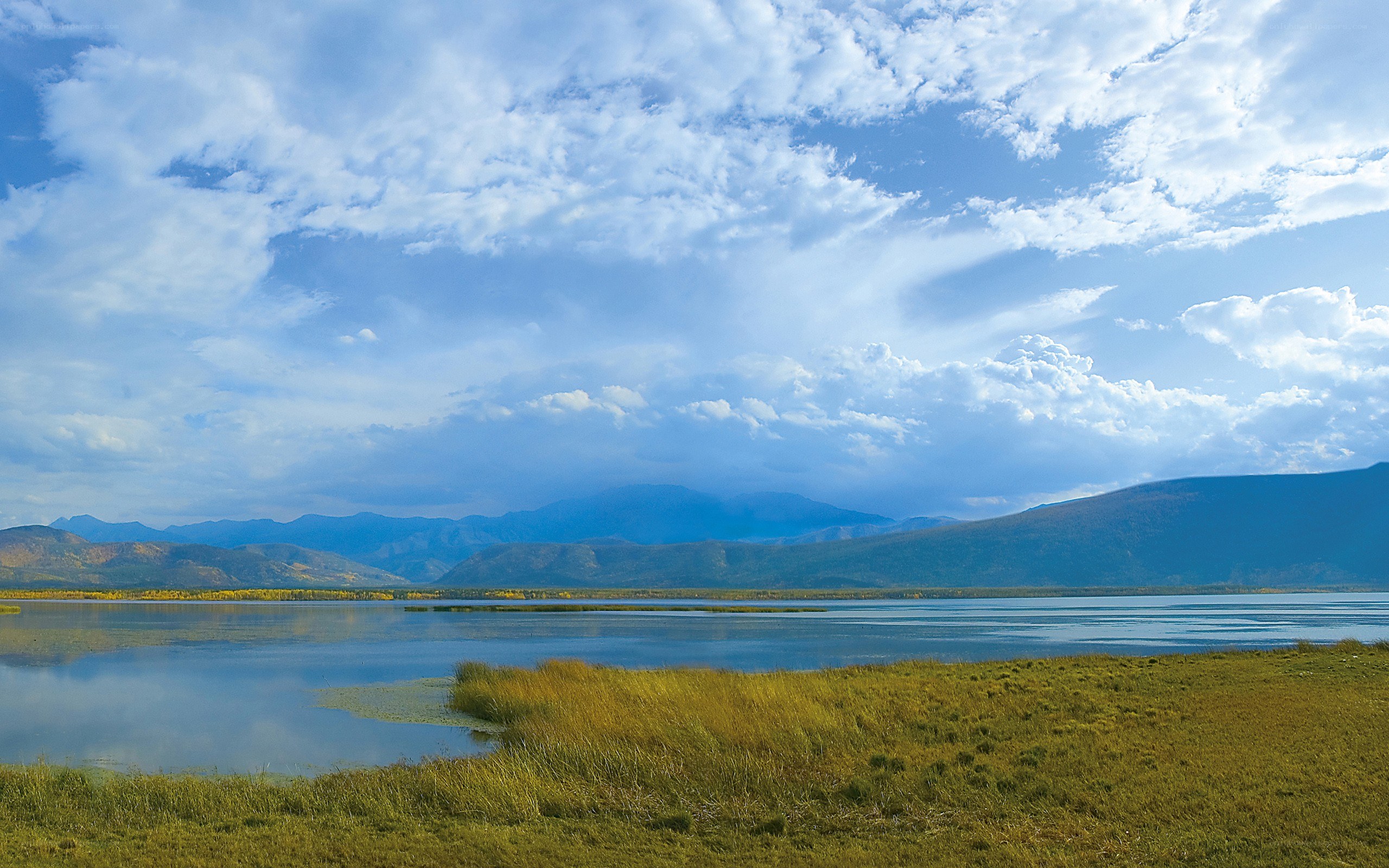 Lake with mountains in background