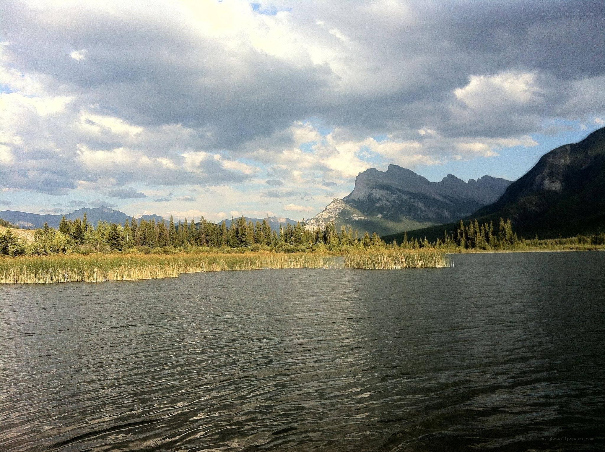 Lake with mountains in background