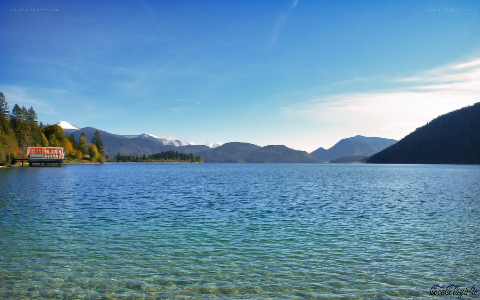 Lake with mountains in background