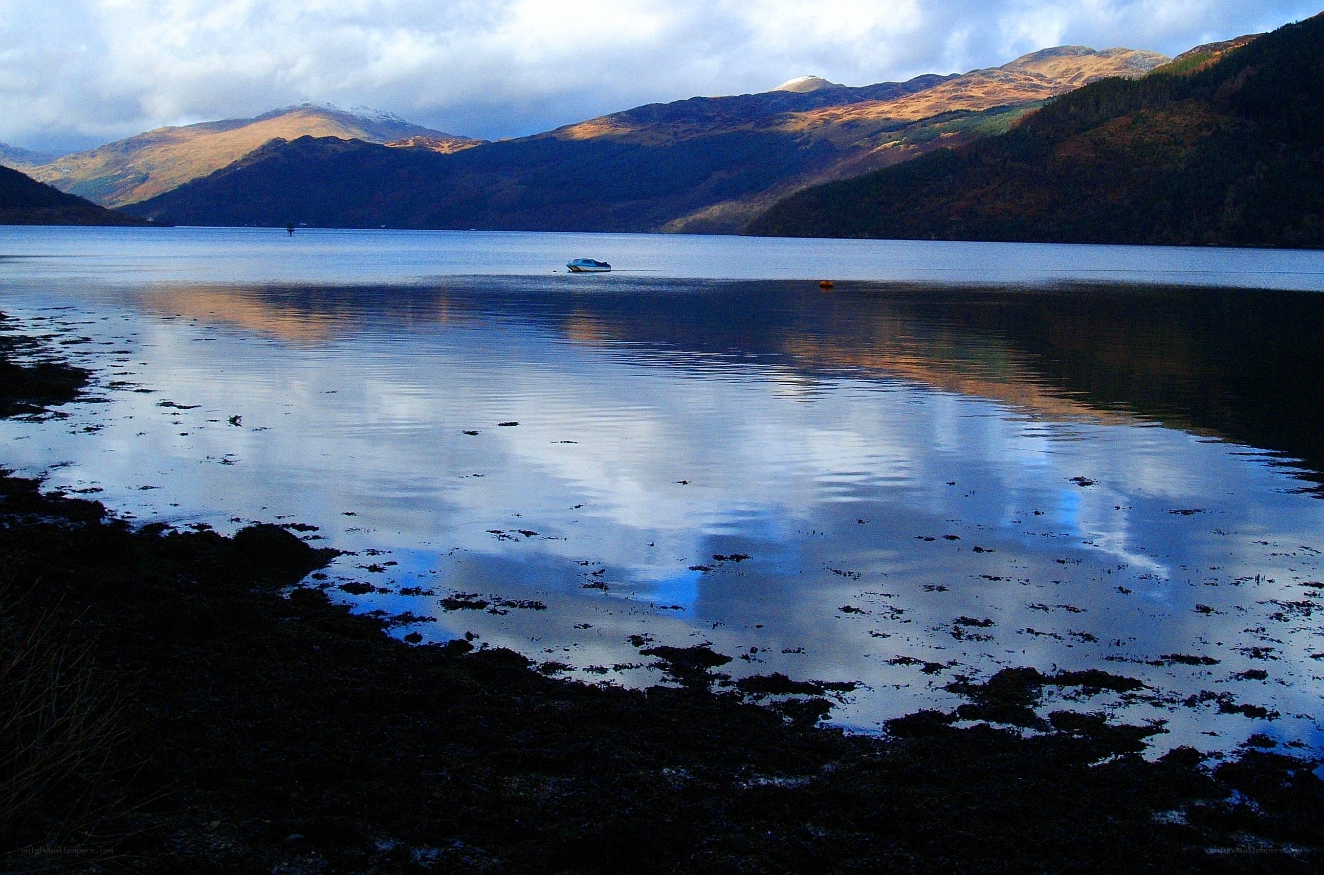 Lake with mountains in background