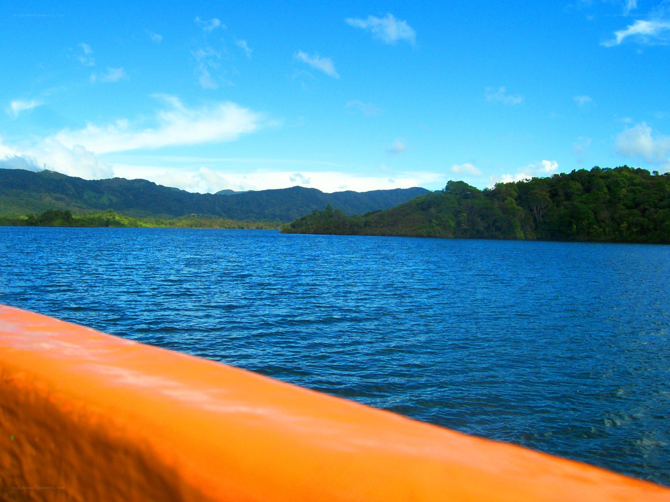 Lake with mountains in background