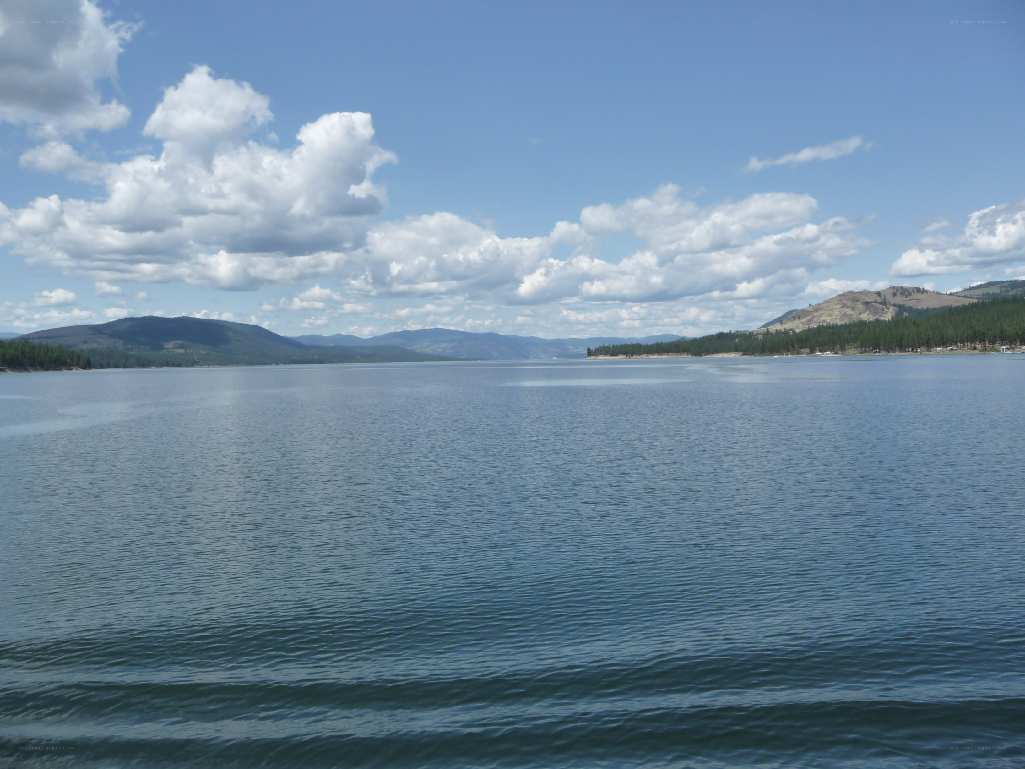 Lake with mountains in background
