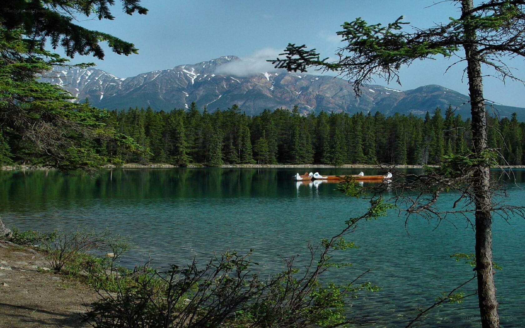 Lake with mountains in background