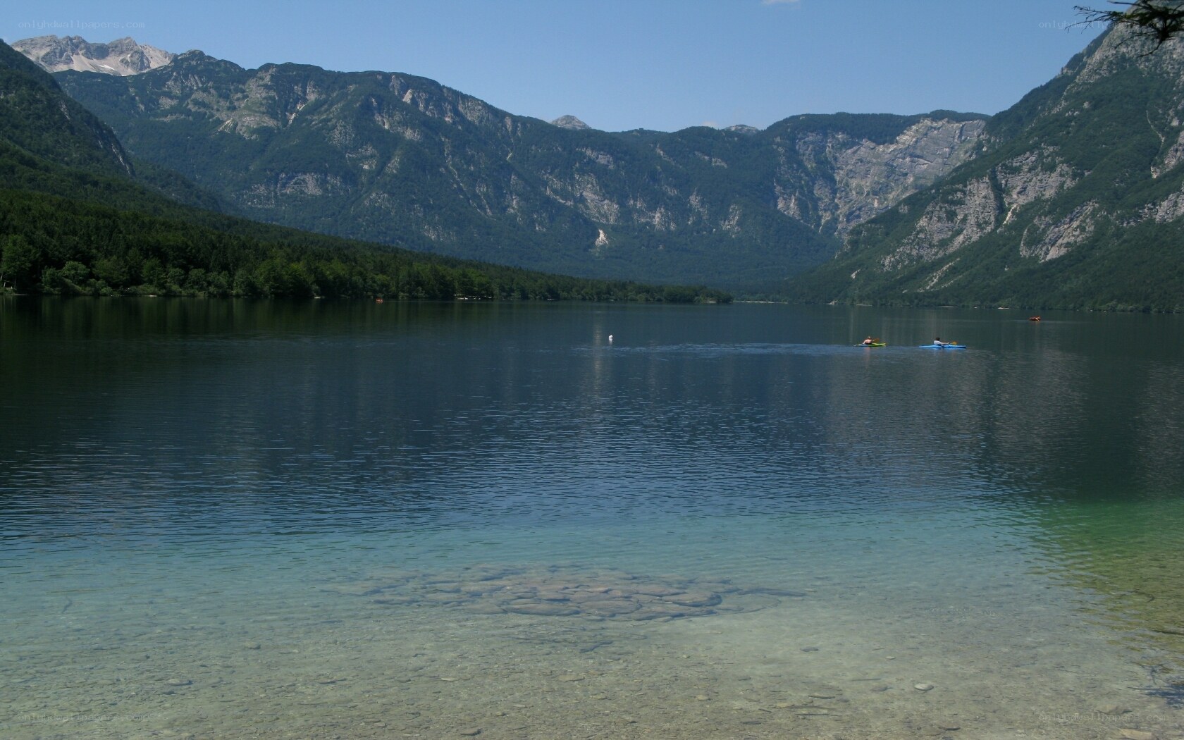 Lake with mountains in background