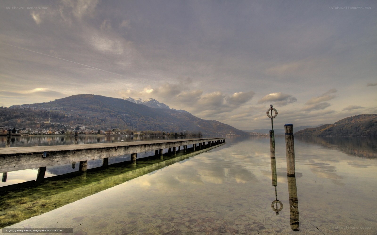Lake with pier and mountains