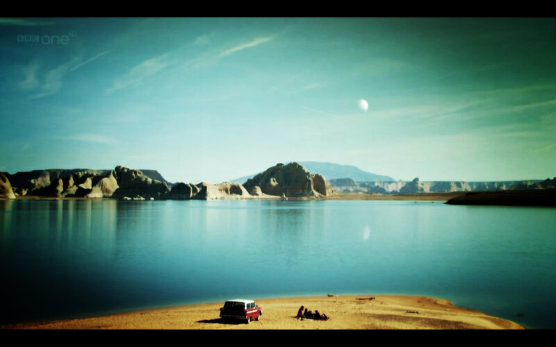 Lake with red car and moon