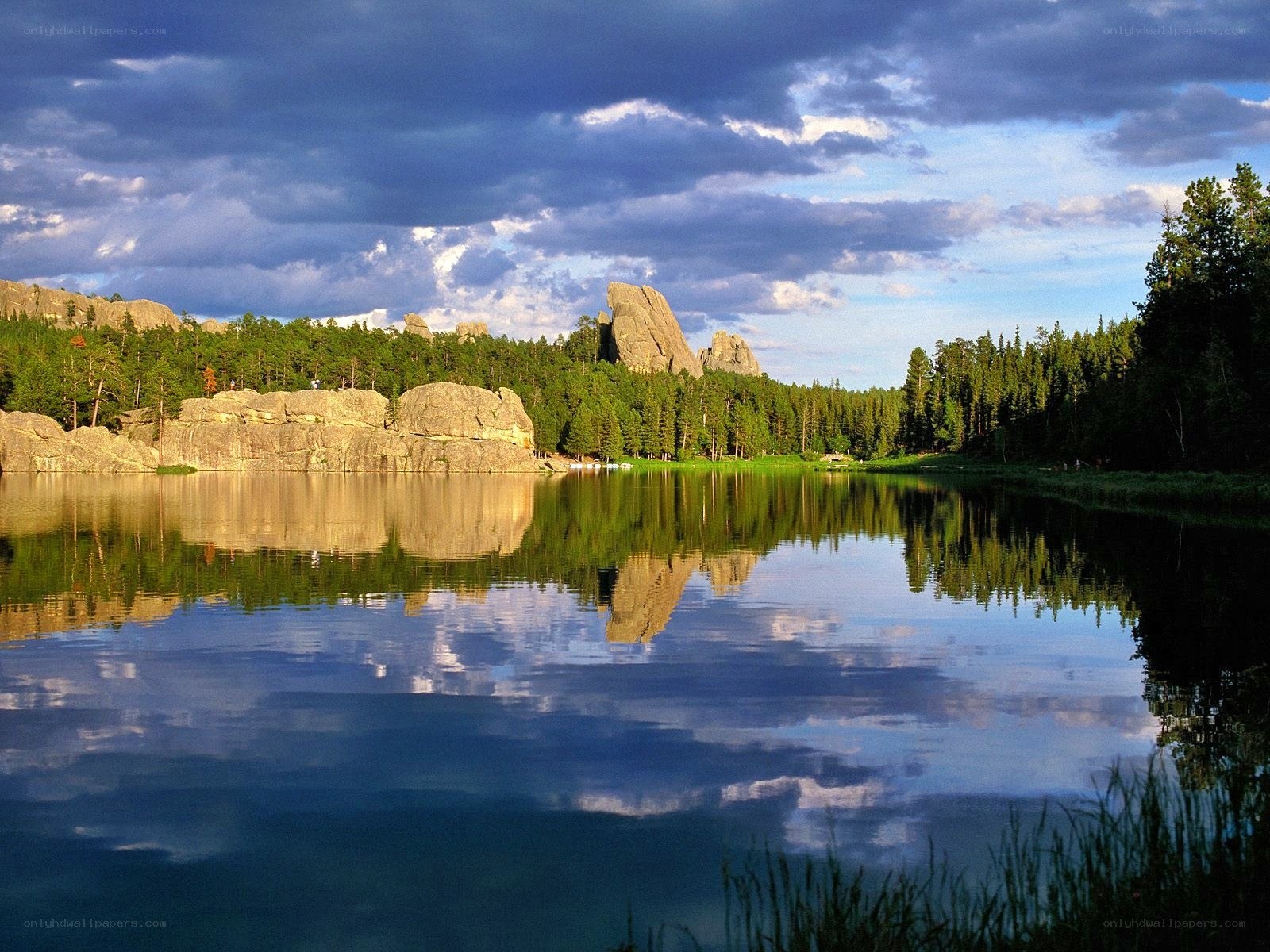Lake with rock formations and forest