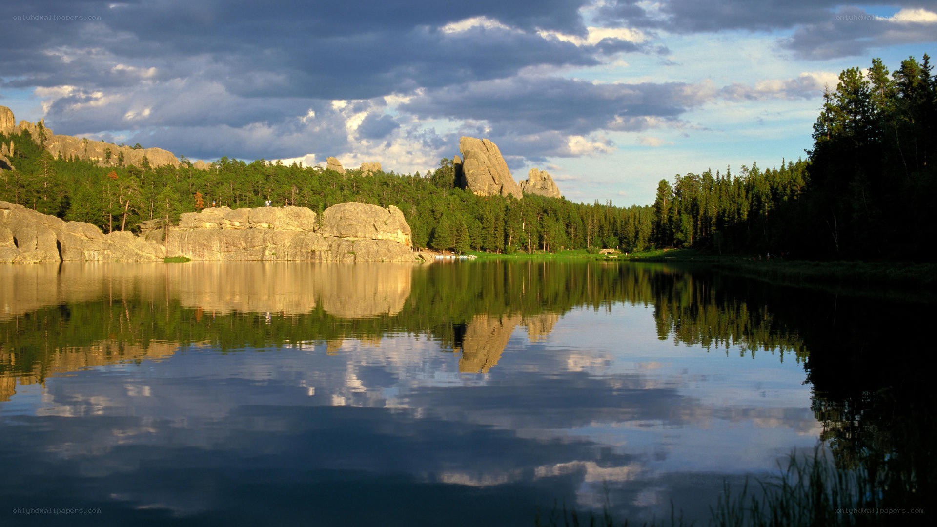 Lake with rock formations and forest