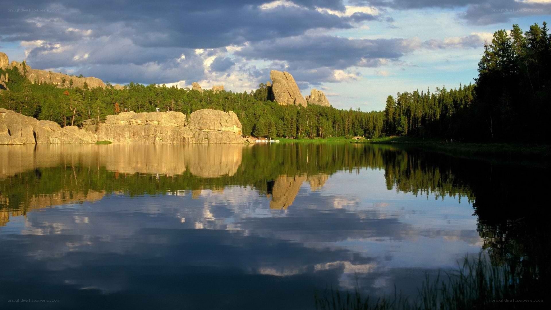 Lake with rock formations and forest