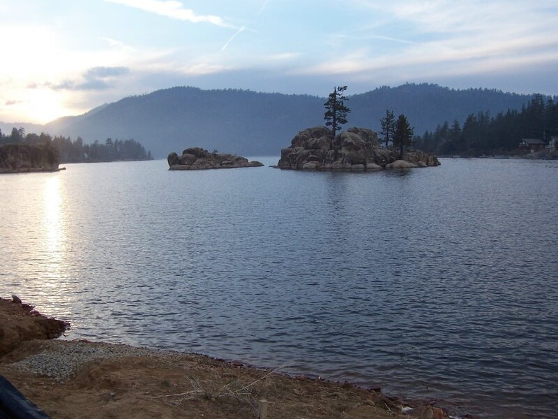 Lake with rocky islands at sunset