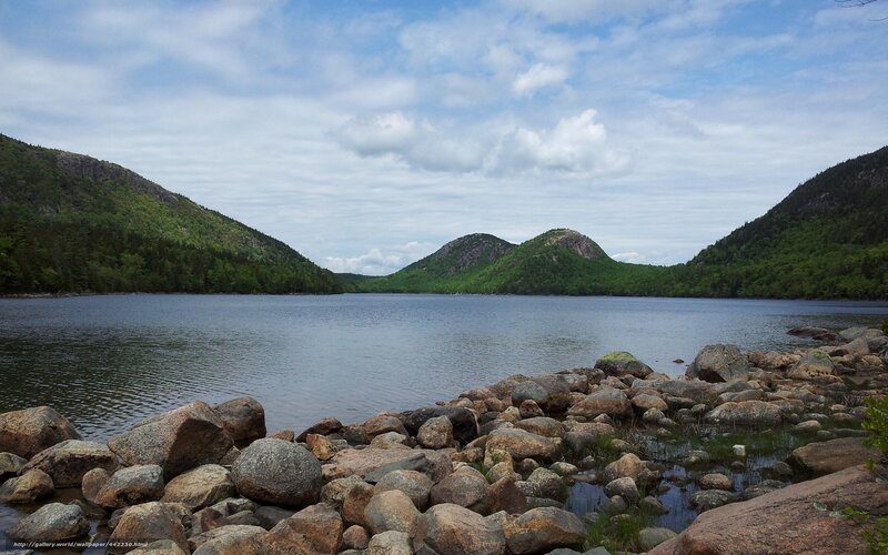 Lake with rocky shore and hills