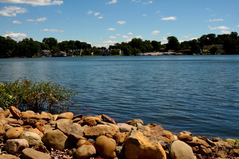 Lake with Rocky Shore — Blue, Serene, Afternoon, Photograph, Rocks