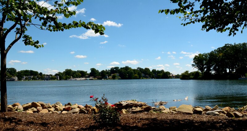 Lake with Rocky Shore — Blue, Serene, Afternoon, Photograph, Trees, Rocks
