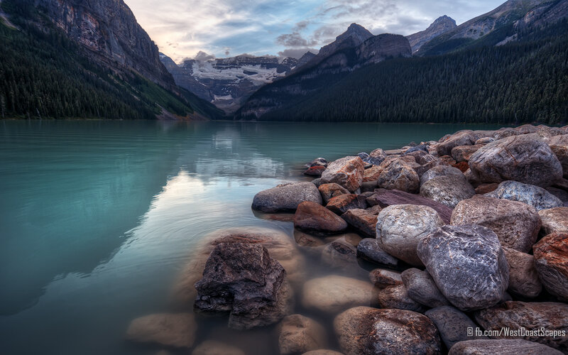 Lake with Rocky Shore — Blue, Serene, Sunset, Photograph, Mountains, Forest