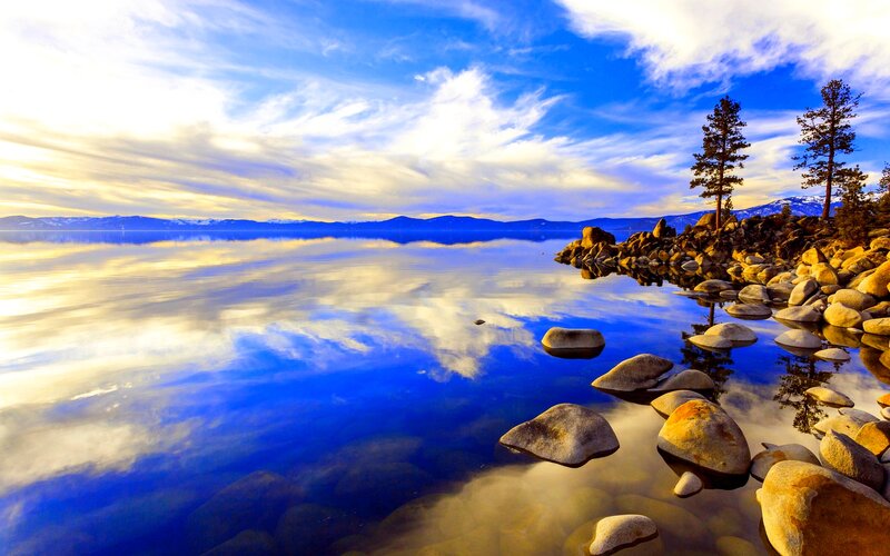 Lake with Rocky Shore — Blue, Serene, Sunset