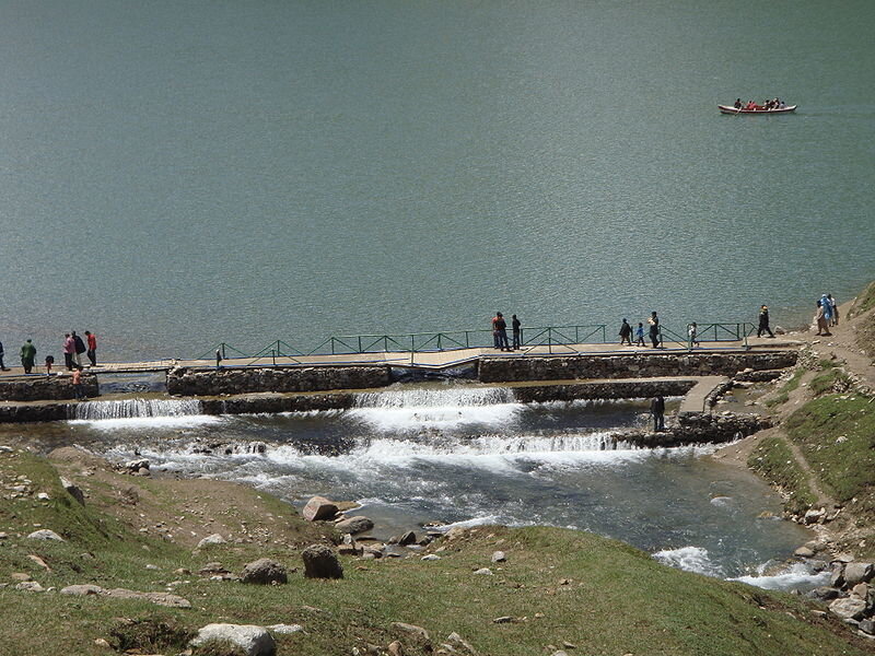 Lake with small dam and boat