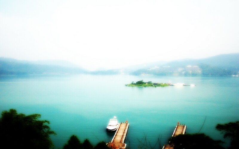 Lake with small island and boats