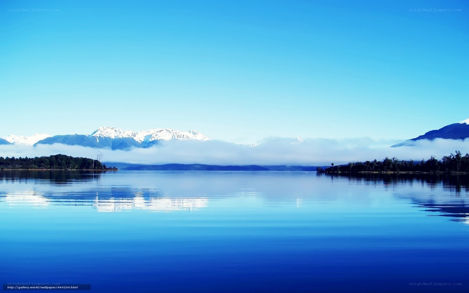 Lake with snow-capped mountains