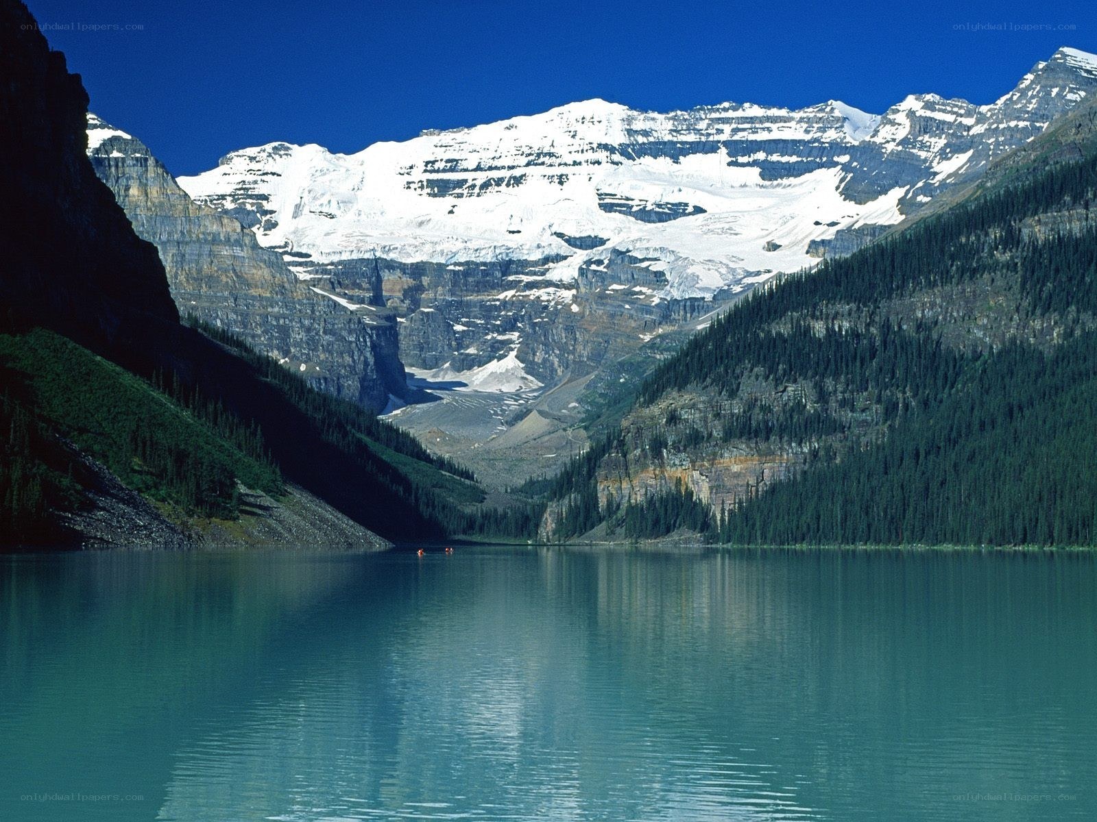 Lake with snow-capped mountains