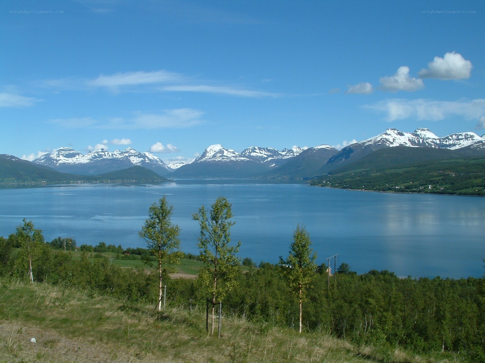 Lake with snow-capped mountains