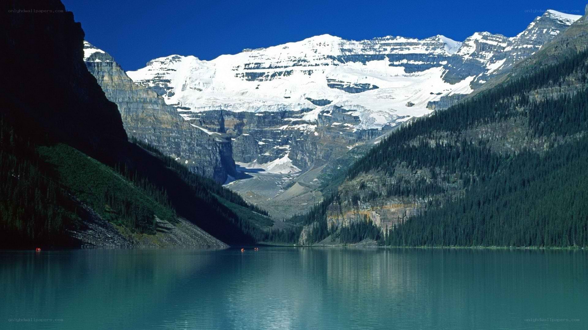 Lake with snow-capped mountains