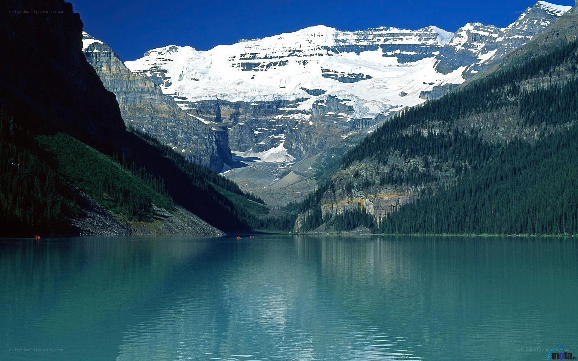Lake with snow-capped mountains