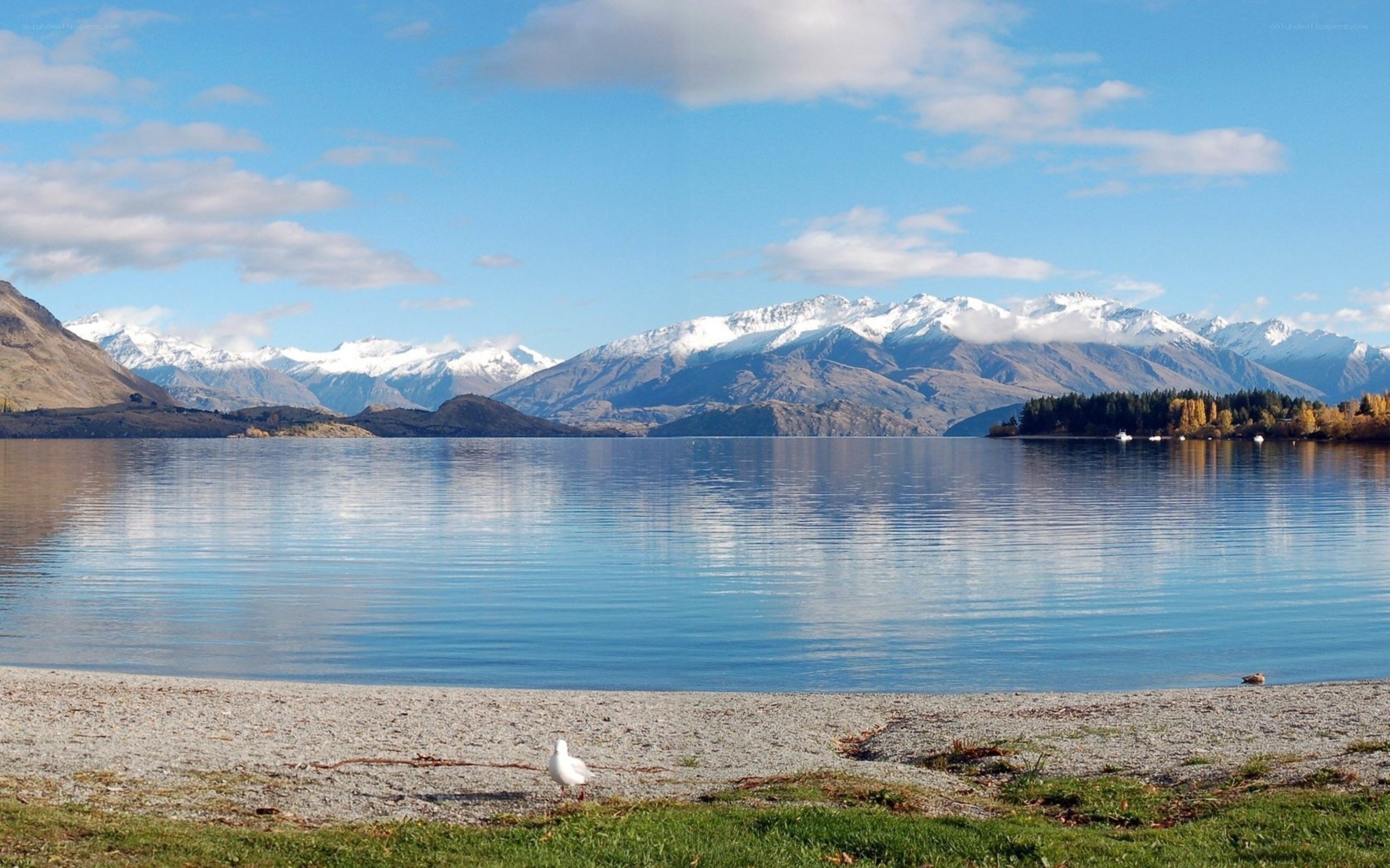 Lake with snow-capped mountains
