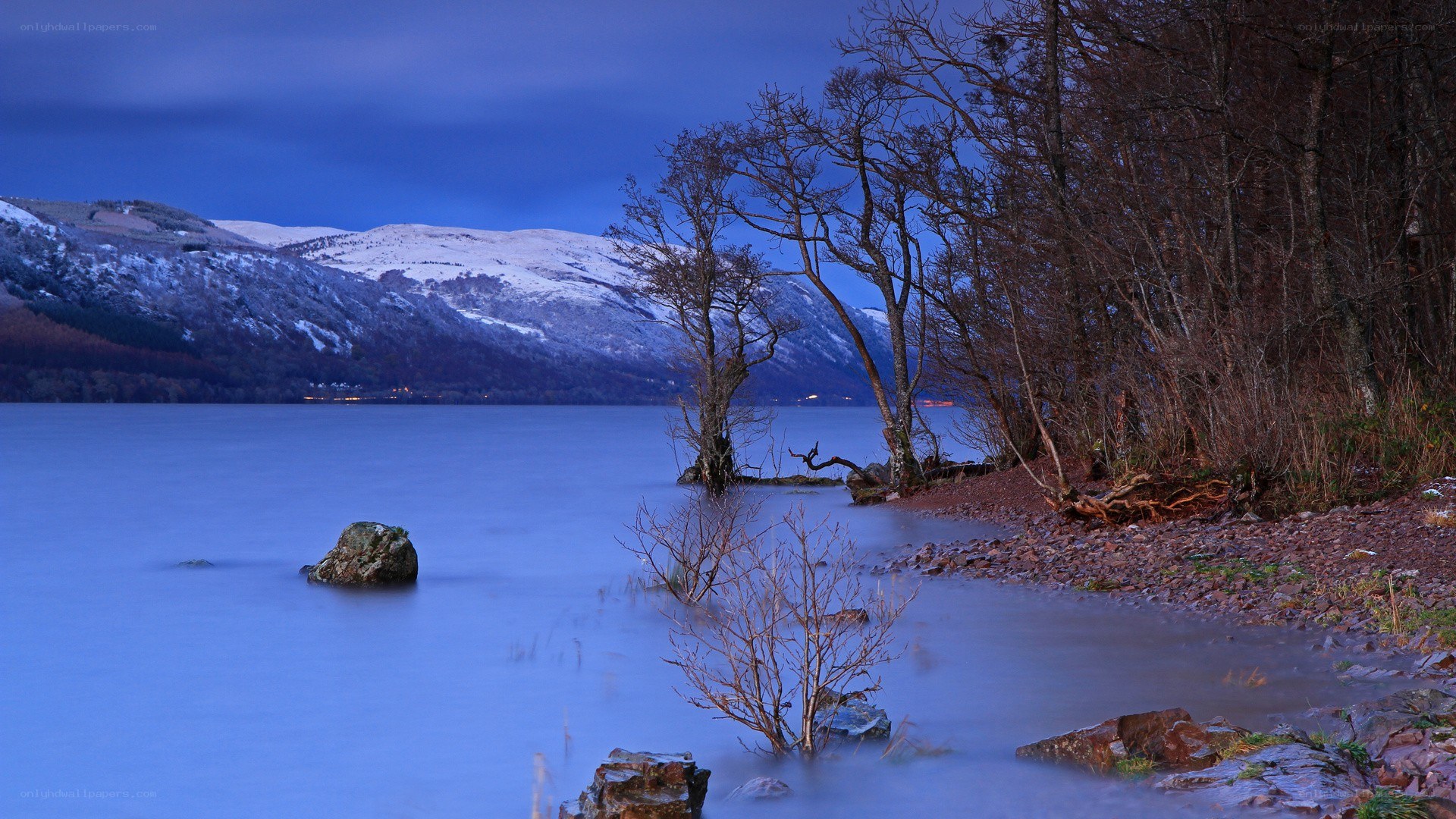 Lake with snow-capped mountains