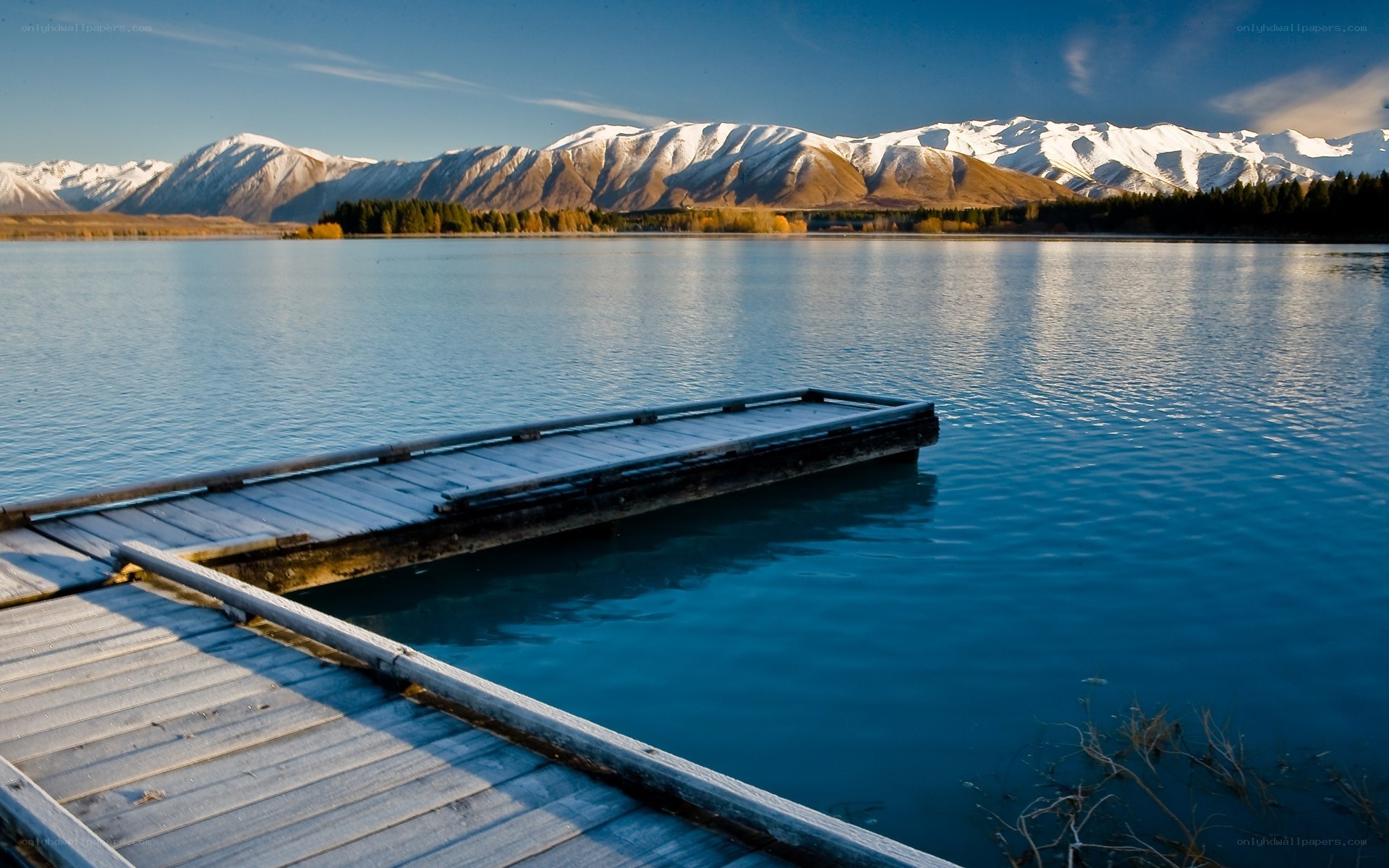 Lake with snow-capped mountains
