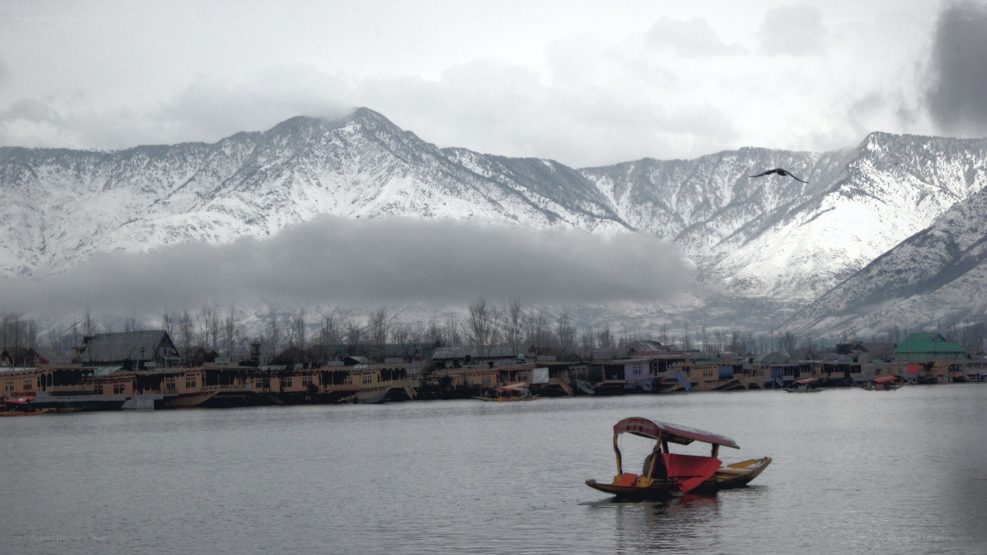Lake with snow-capped mountains
