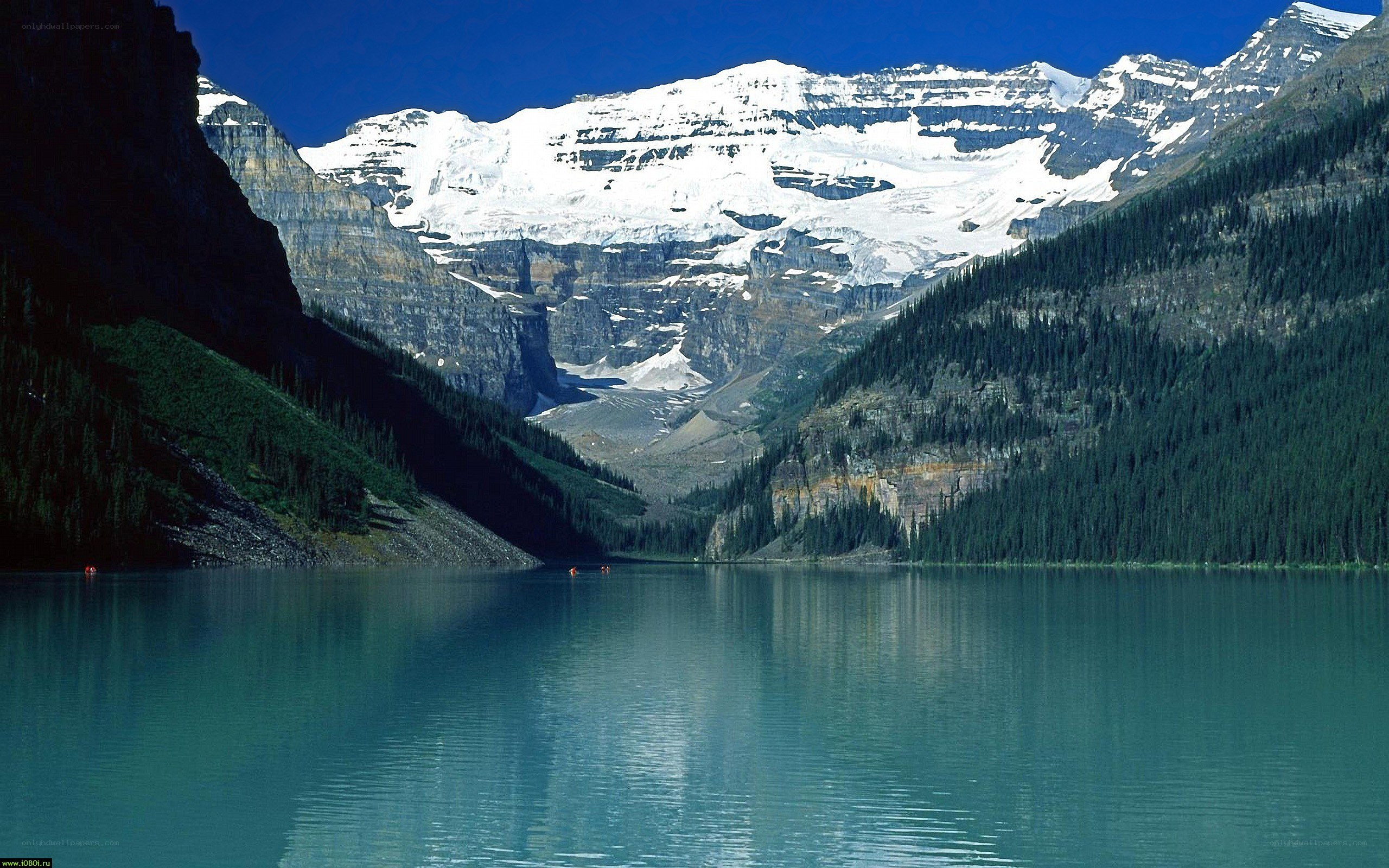 Lake with snow-capped mountains
